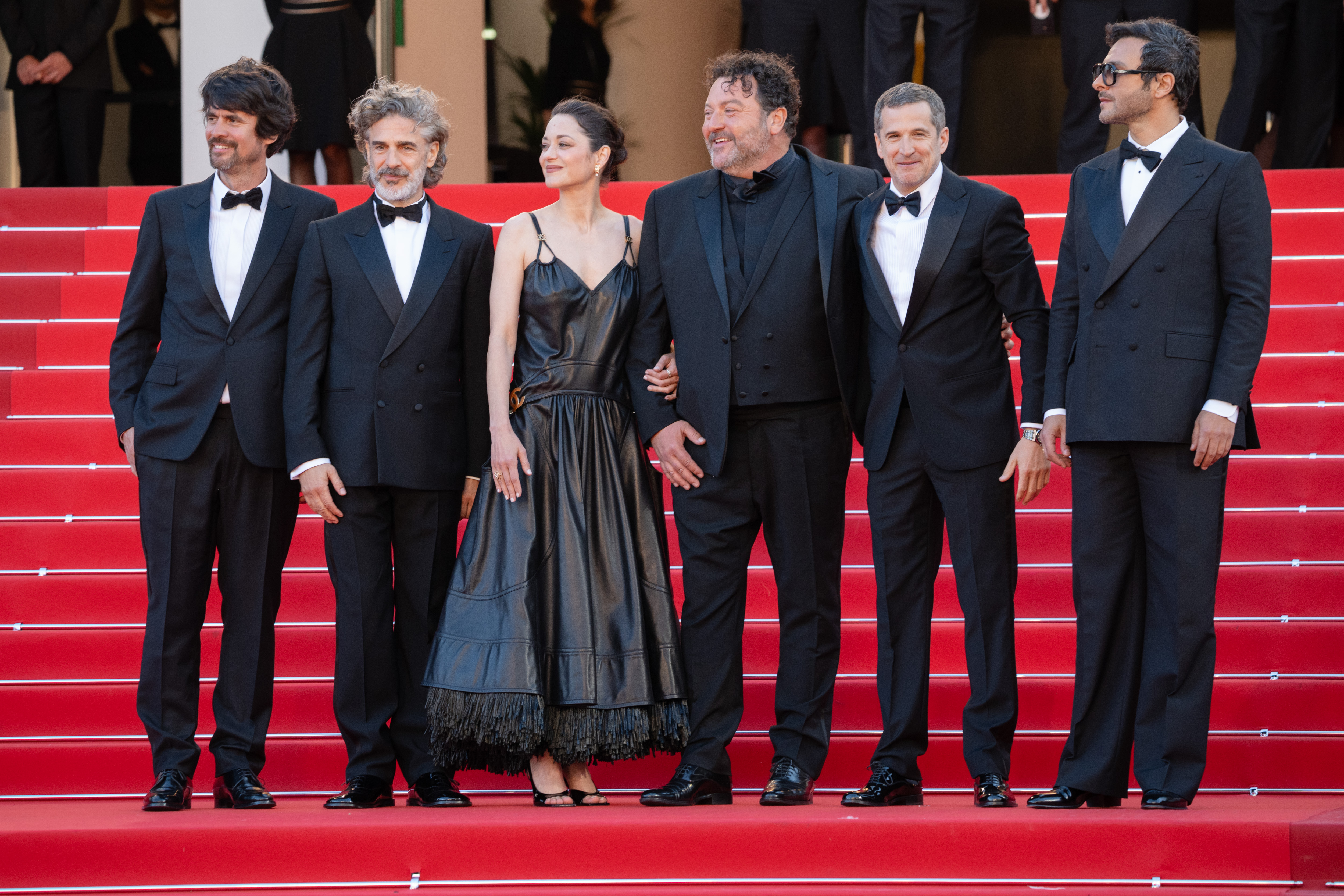 Image Description: Simon Jacquet Leonardo Sbaraglia Marion Cotillard Denis Menochet Guillaume Canet and Yodelice attend the special screening red carpet of the movie Karma during the 79th Cannes Film Festival Cannes France 2026-05-15