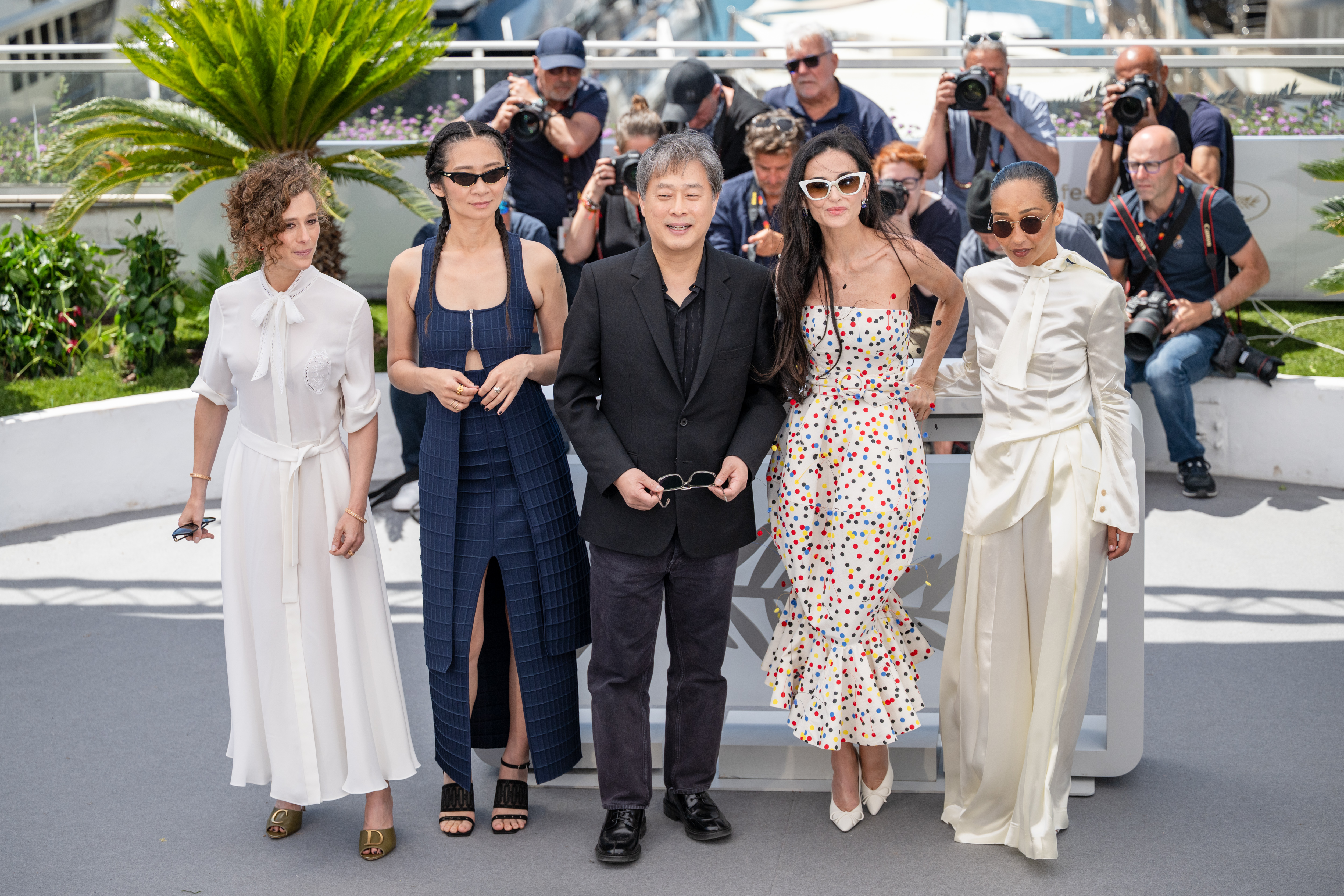 Image Description: Jury Members Laura Wandel Chloe Zhao Jury President Park Chan-wook Jury Members Demi Moore and Ruth Negga attend the jury photocall during the 79th Cannes Film Festival Cannes France 2026-05-12
