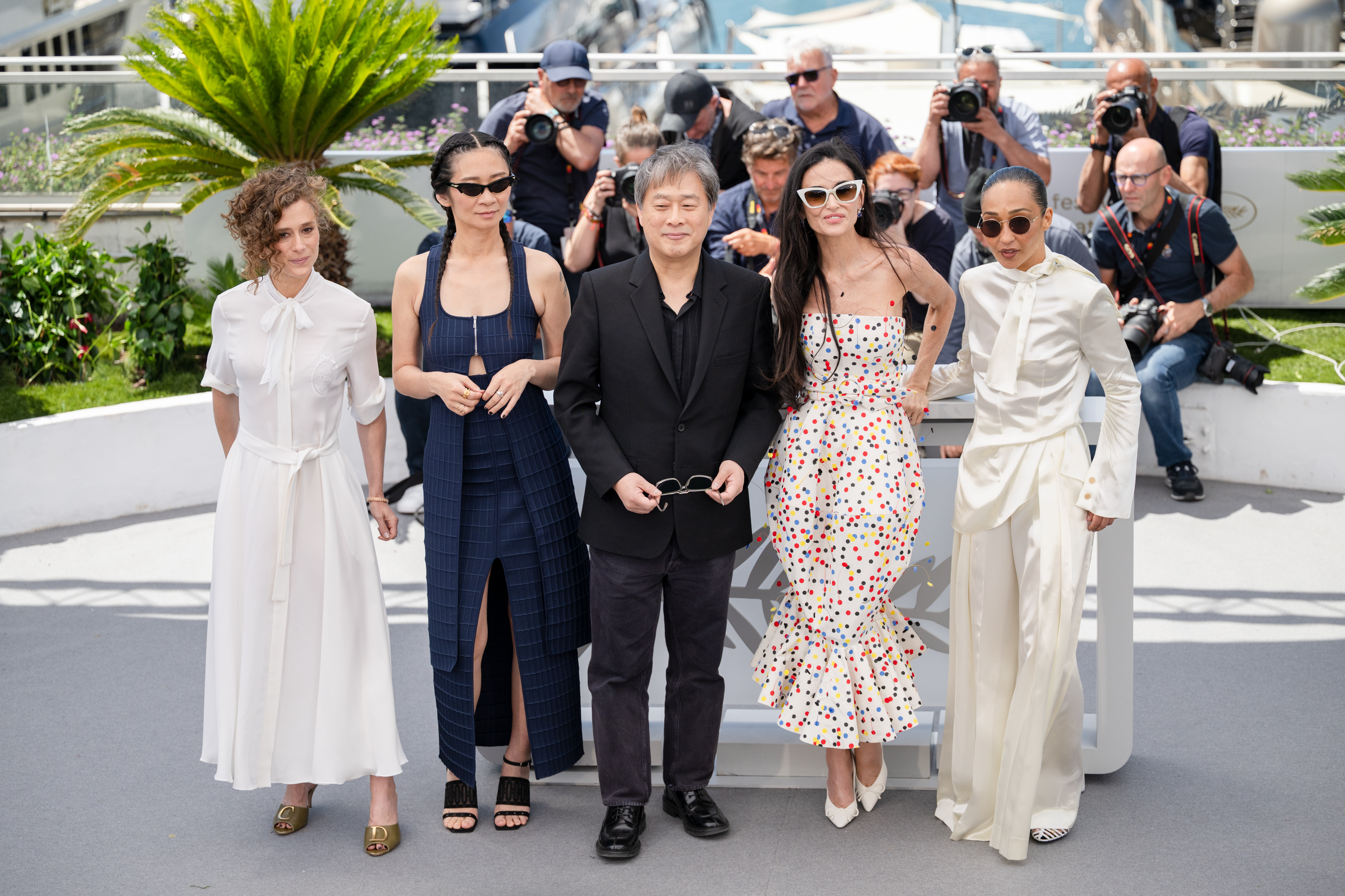 Image Description: Jury Members Laura Wandel Chloe Zhao Jury President Park Chan-wook Jury Members Demi Moore and Ruth Negga attend the jury photocall during the 79th Cannes Film Festival Cannes France 2026-05-12