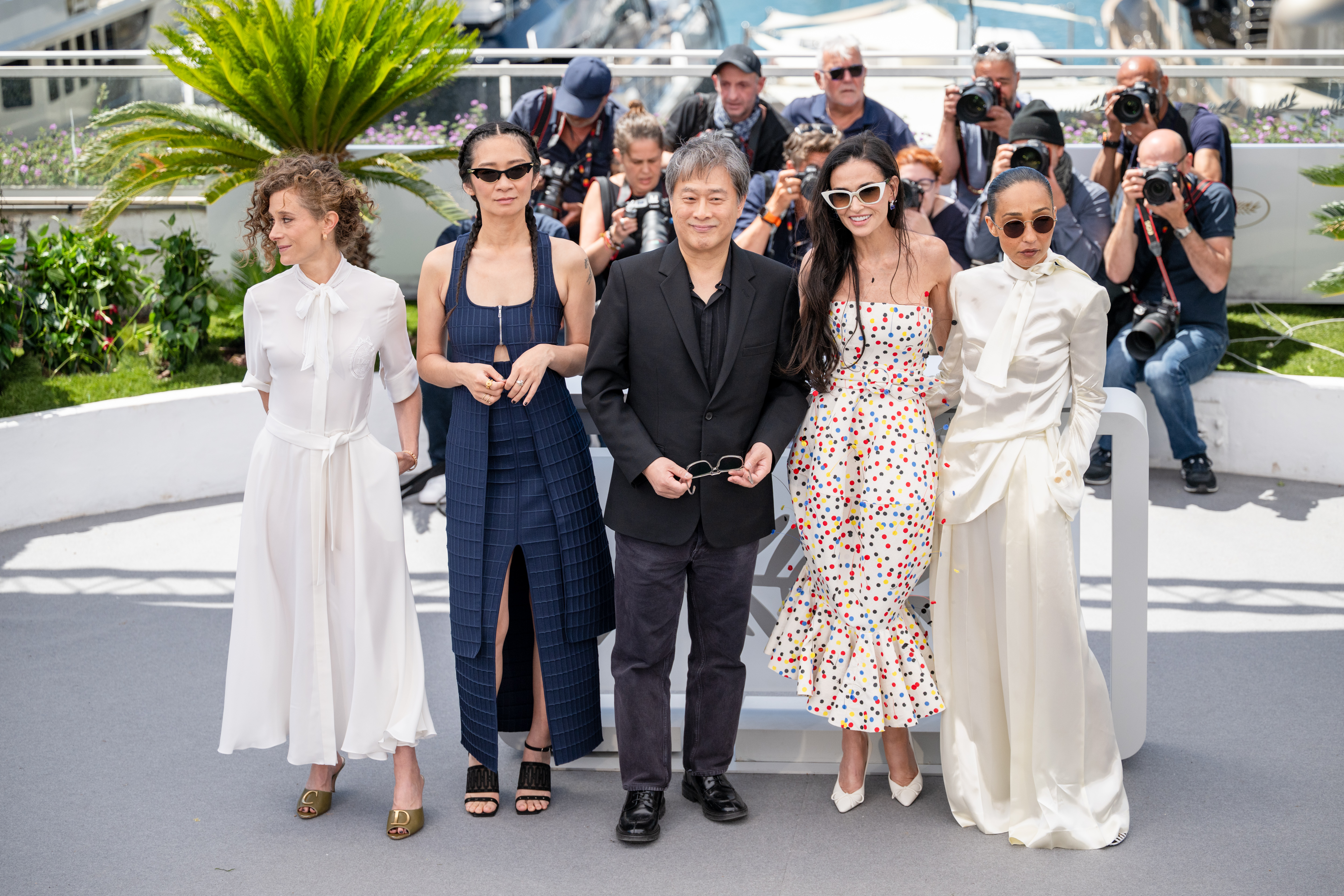 Image Description: Jury Members Laura Wandel Chloe Zhao Jury President Park Chan-wook Jury Members Demi Moore and Ruth Negga attend the jury photocall during the 79th Cannes Film Festival Cannes France 2026-05-12