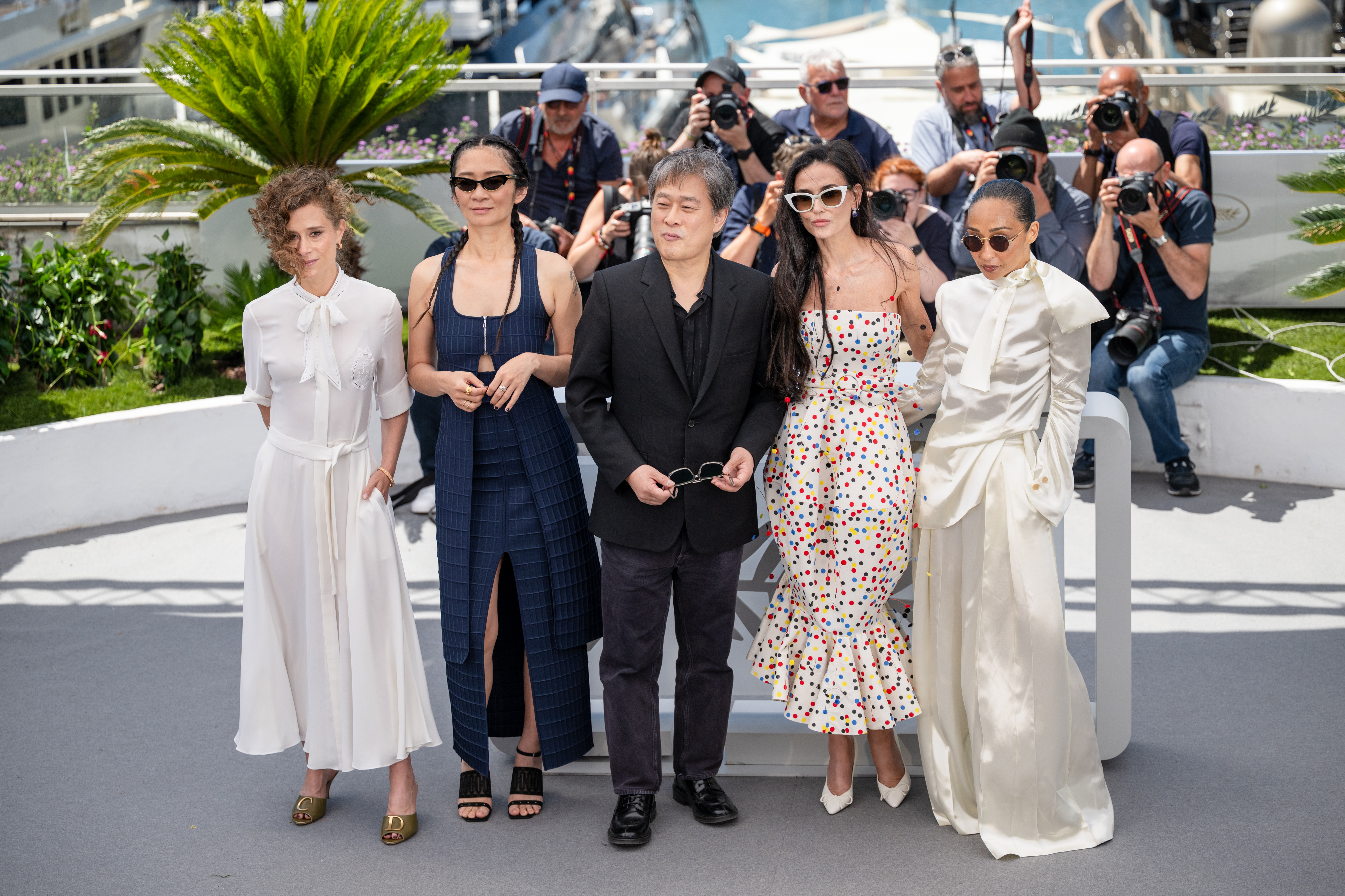 Image Description: Jury Members Laura Wandel Chloe Zhao Jury President Park Chan-wook Jury Members Demi Moore and Ruth Negga attend the jury photocall during the 79th Cannes Film Festival Cannes France 2026-05-12