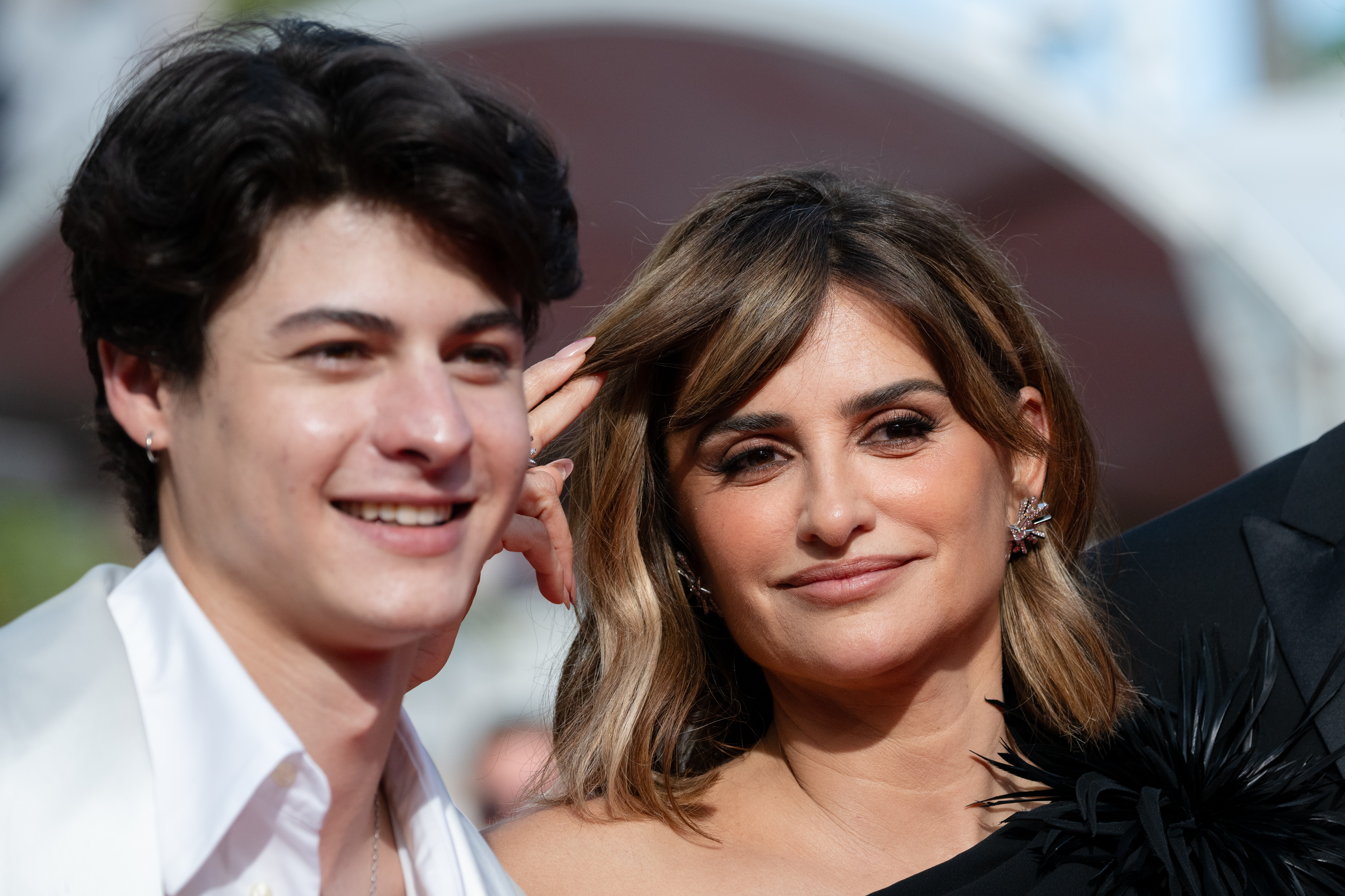 Image Description: Milo Quifes and Penelope Cruz attend the competition screening red carpet of the movie La Bola Negra during the 79th Cannes Film Festival Cannes France 2026-05-21
