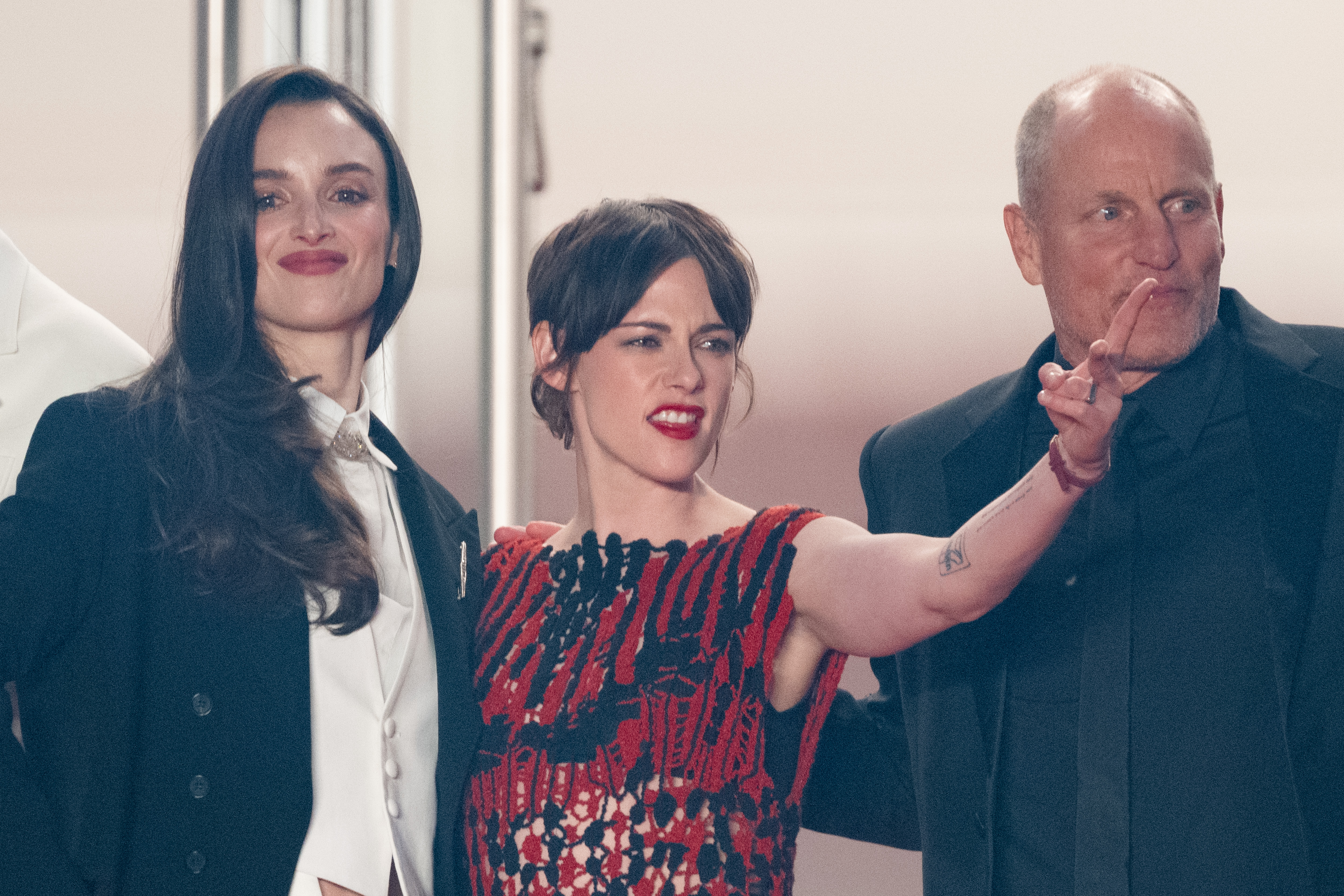 Image Description: Charlotte Le Bon Kristen Stewart and Woody Harrelson attend the midnight screening of the movie Full Phil during the 79th Cannes Film Festival Cannes France 2026-05-16