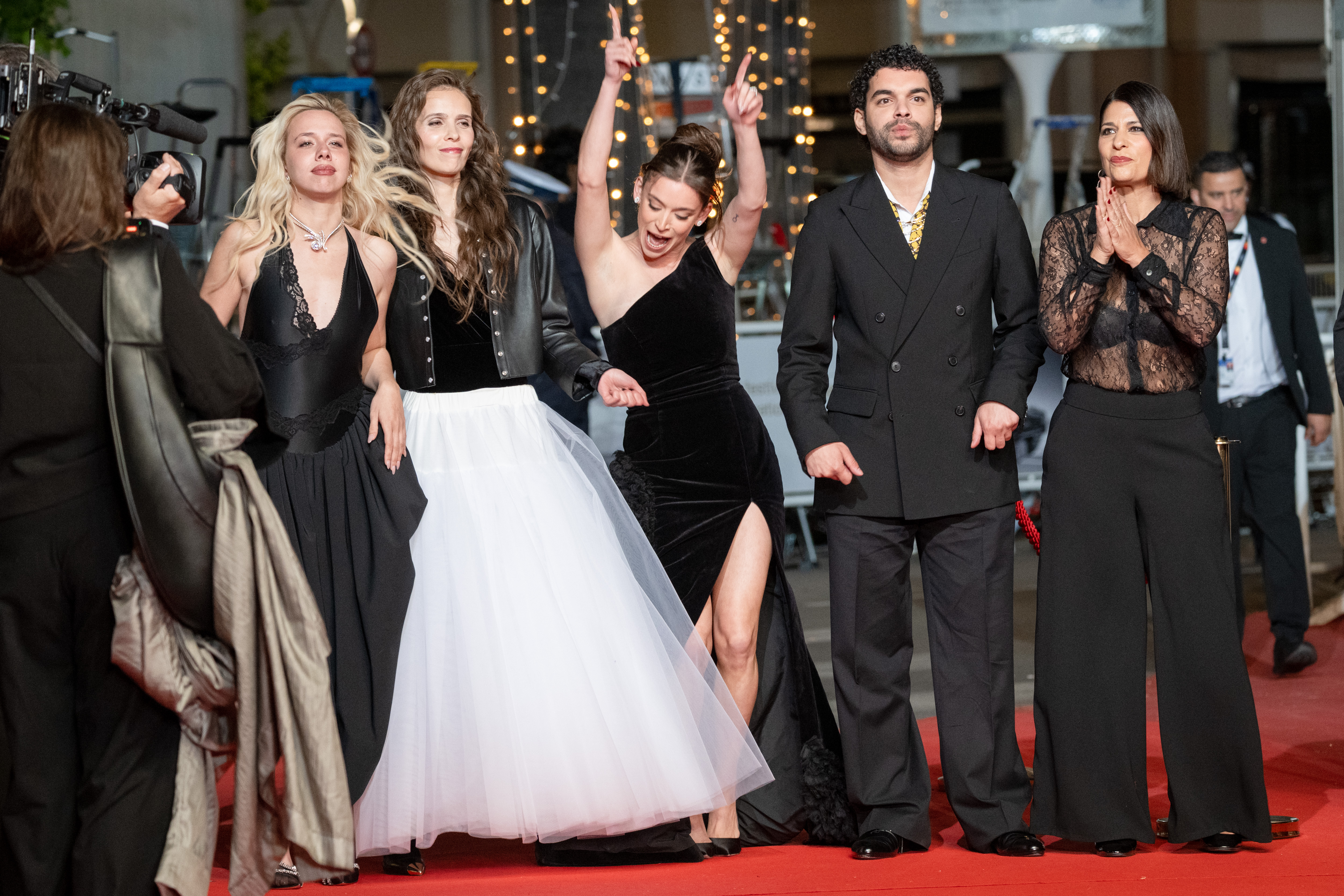 Image Description: Kim Higelin Marion Le Corroller Mara Taquin Sami Outalbali and Carole Lambert attend the midnight screening of the movie Sanguine during the 79th Cannes Film Festival Cannes France 2026-05-14
