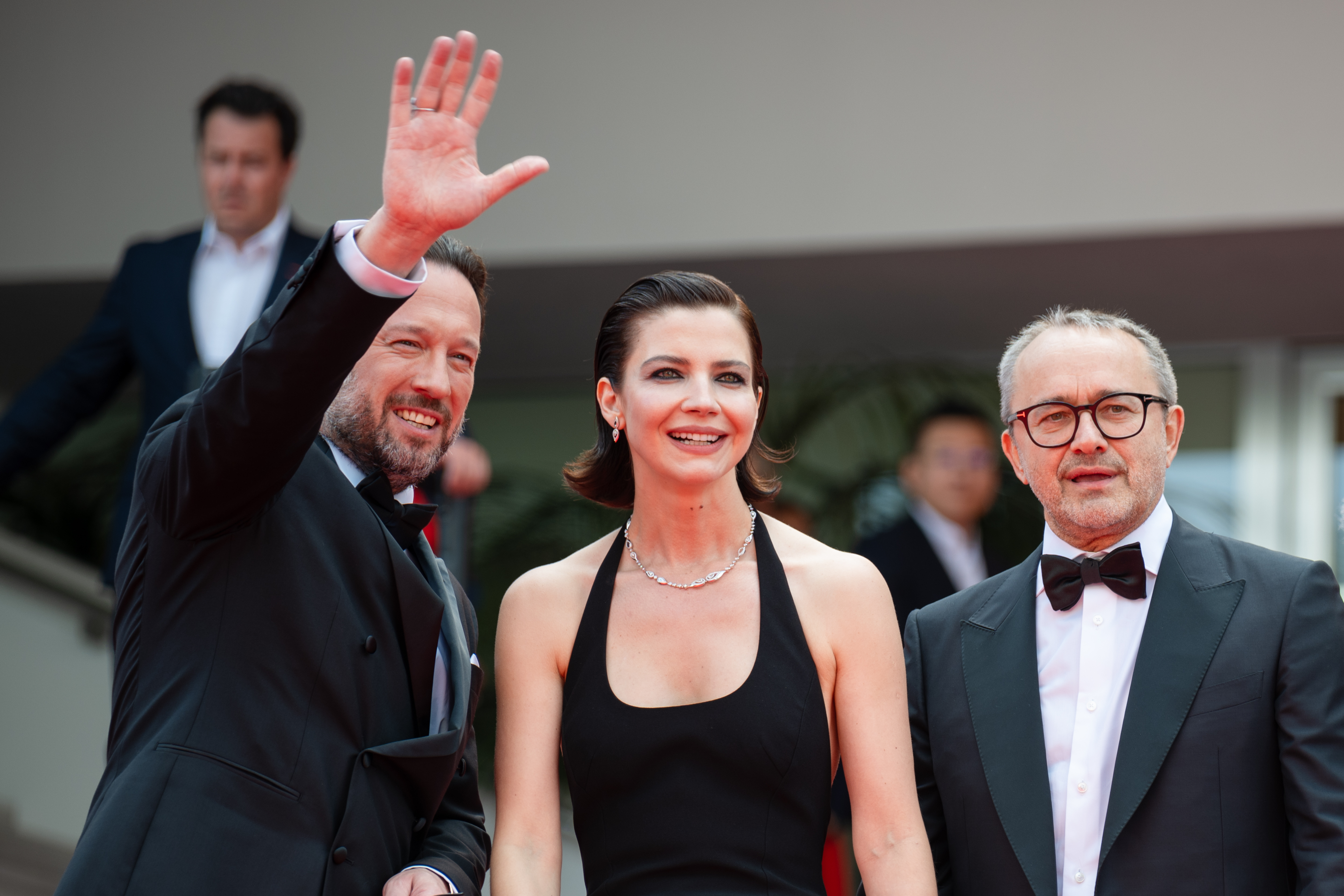 Image Description: Dmitriy Mazurov Iris Lebedeva and Andrey Zvyagintsev attend the competition screening red carpet of the movie Minotaur during the 79th Cannes Film Festival Cannes France 2026-05-19