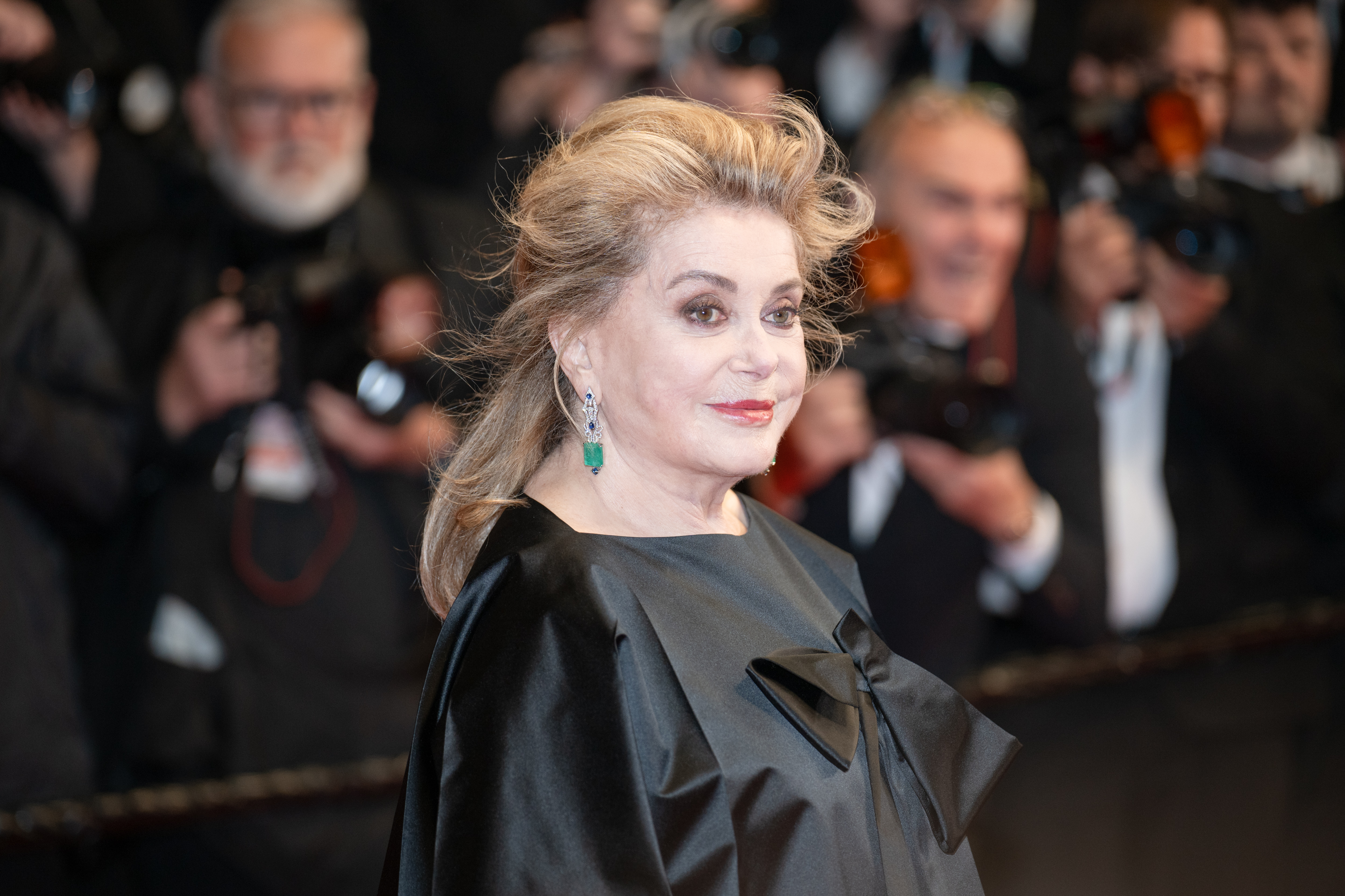 Image Description: Catherine Deneuve attends the competition screening red carpet of the movie Gentle Monster during the 79th Cannes Film Festival Cannes France 2026-05-15