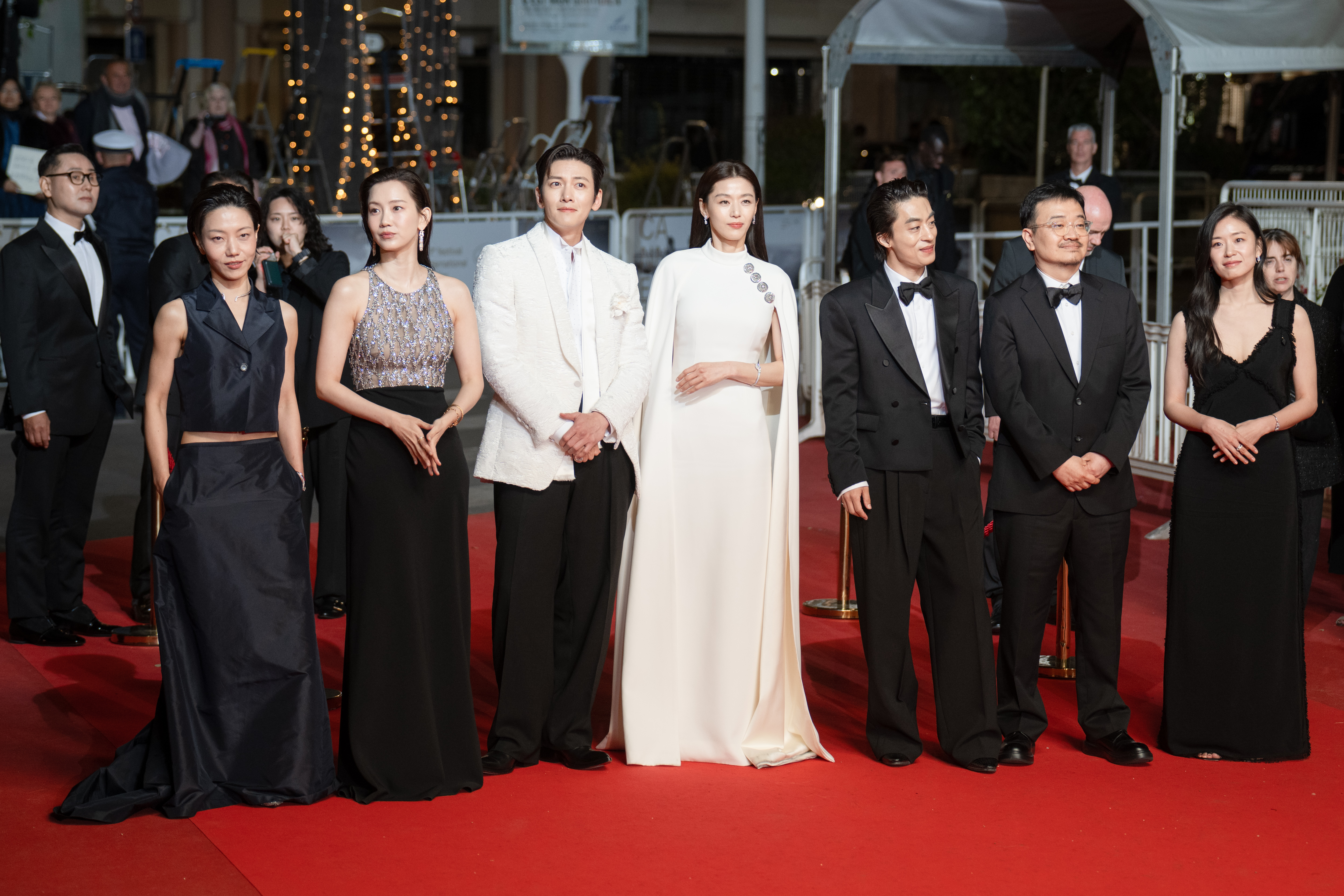 Image Description: Kim Shin-rok Hyun-Been Shin Ji Chang-wook Gianna Jun Kyo-Hwan Koo Yeon Sang-ho and Yang Yu-min attend the midnight screening of the movie Gun-Che during the 79th Cannes Film Festival Cannes France 2026-05-15