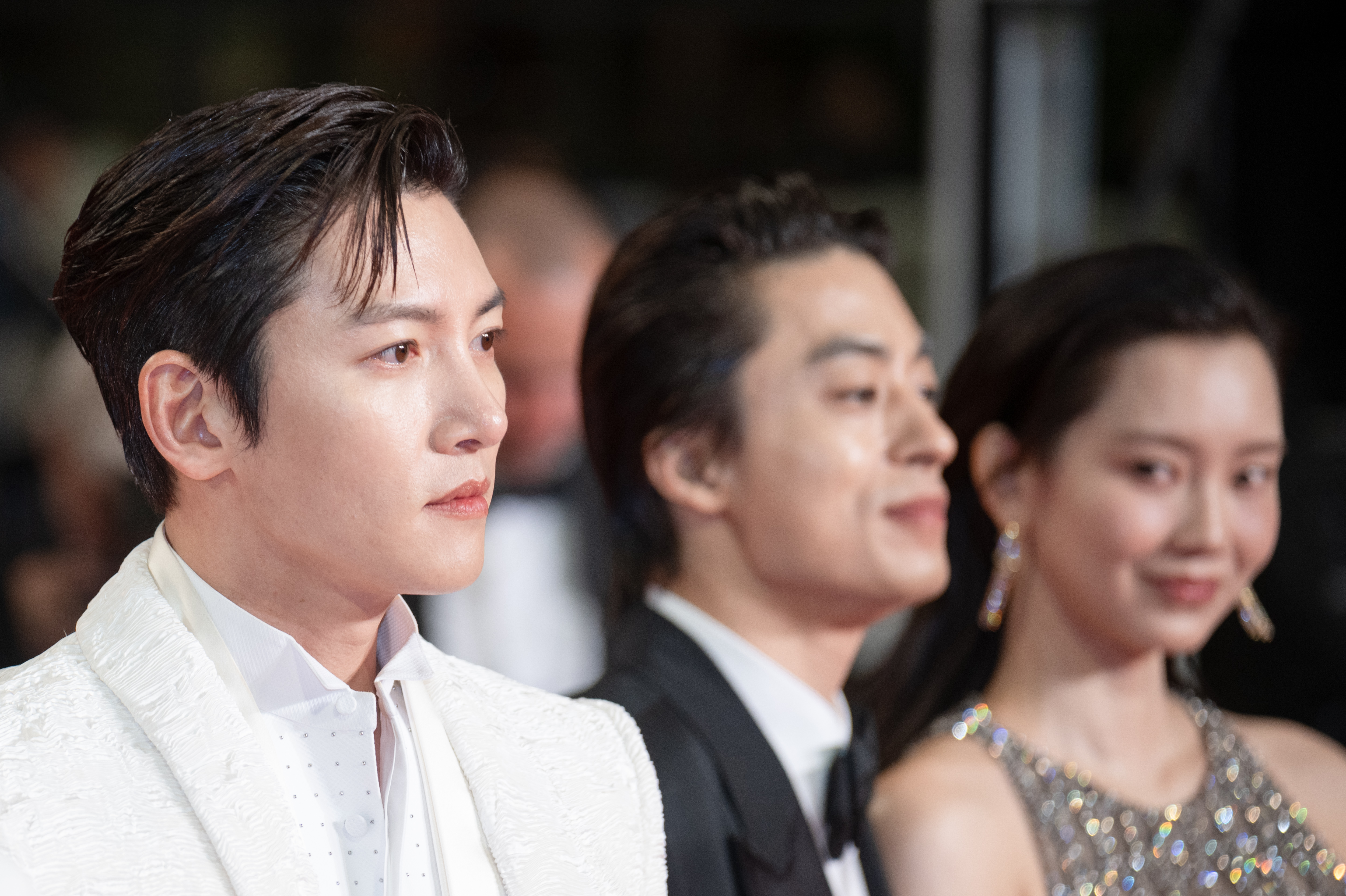 Image Description: Ji Chang-wook Kyo-Hwan Koo and Hyun-Been Shin attend the midnight screening of the movie Gun-Che during the 79th Cannes Film Festival Cannes France 2026-05-15