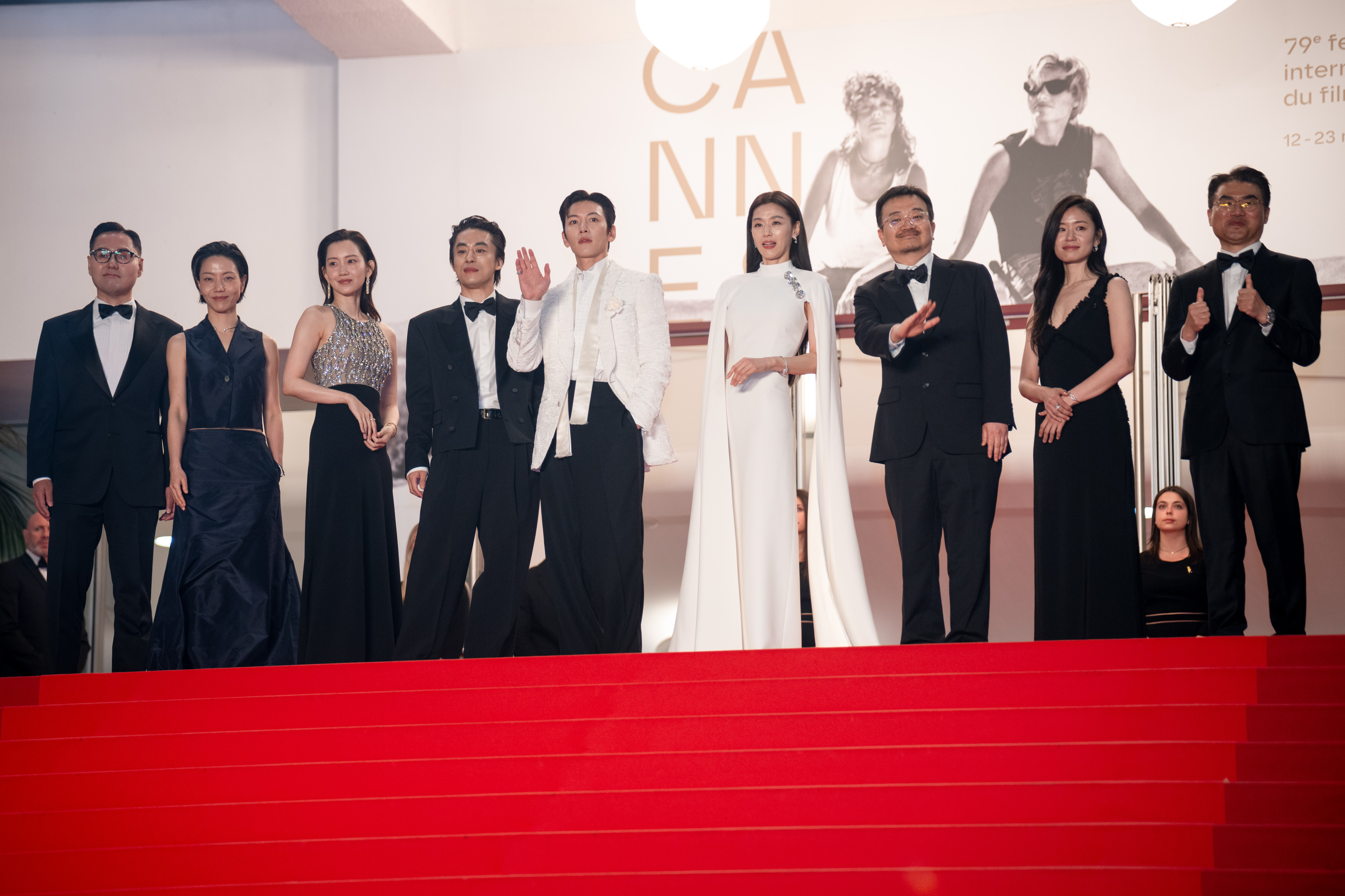 Image Description: A guest Kim Shin-rok Shin Hyun-been Koo Kyo-hwan Ji Chang-wook Jun Ji-hyun Yeon Sang-ho Yang Yu-min and a guest attend the midnight screening of the movie Gun-Che during the 79th Cannes Film Festival Cannes France 2026-05-15