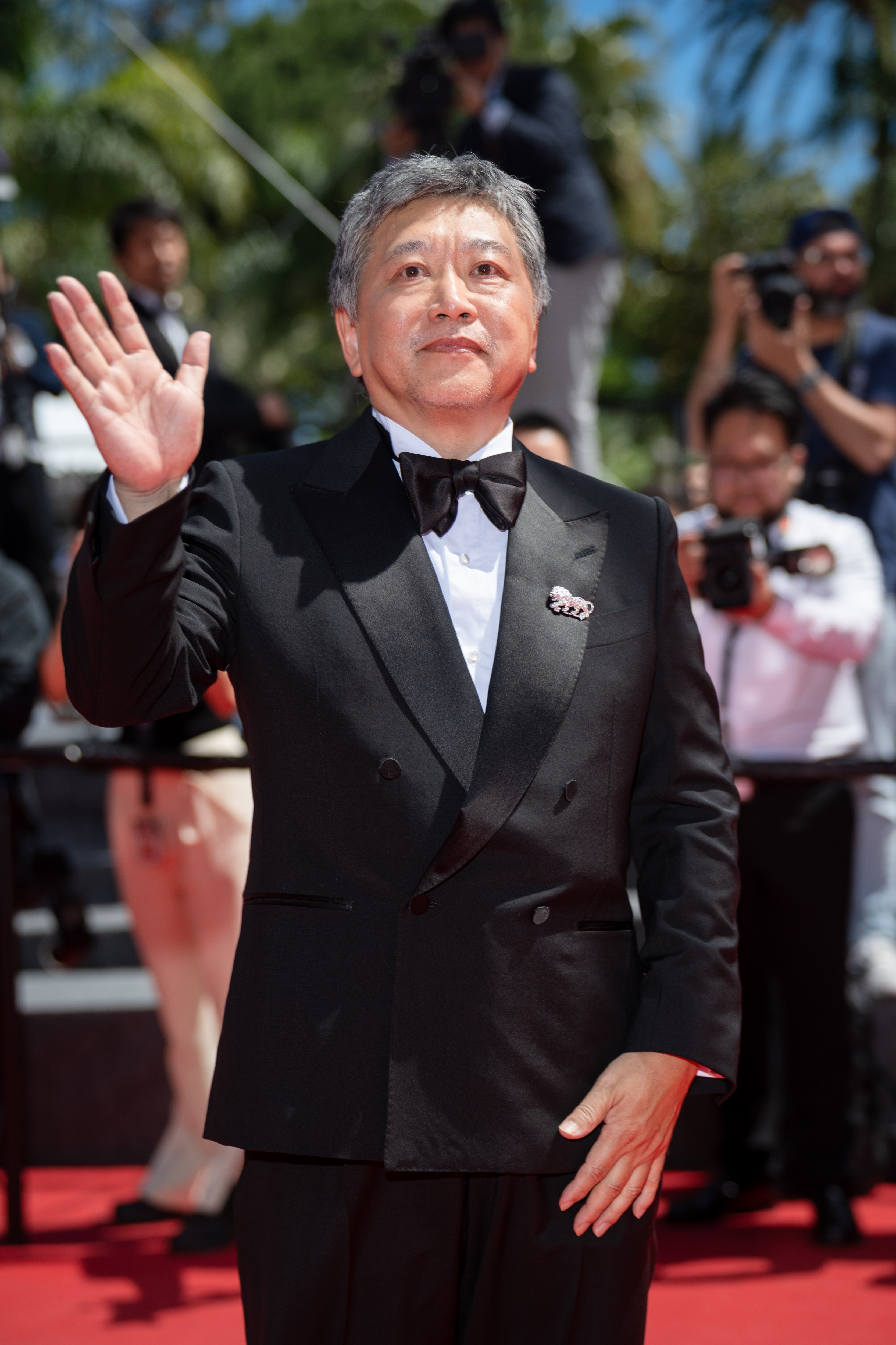Image Description: Hirokazu Kore-eda attends the competition screening red carpet of the movie Sheep in the Box during the 79th Cannes Film Festival Cannes France 2026-05-16