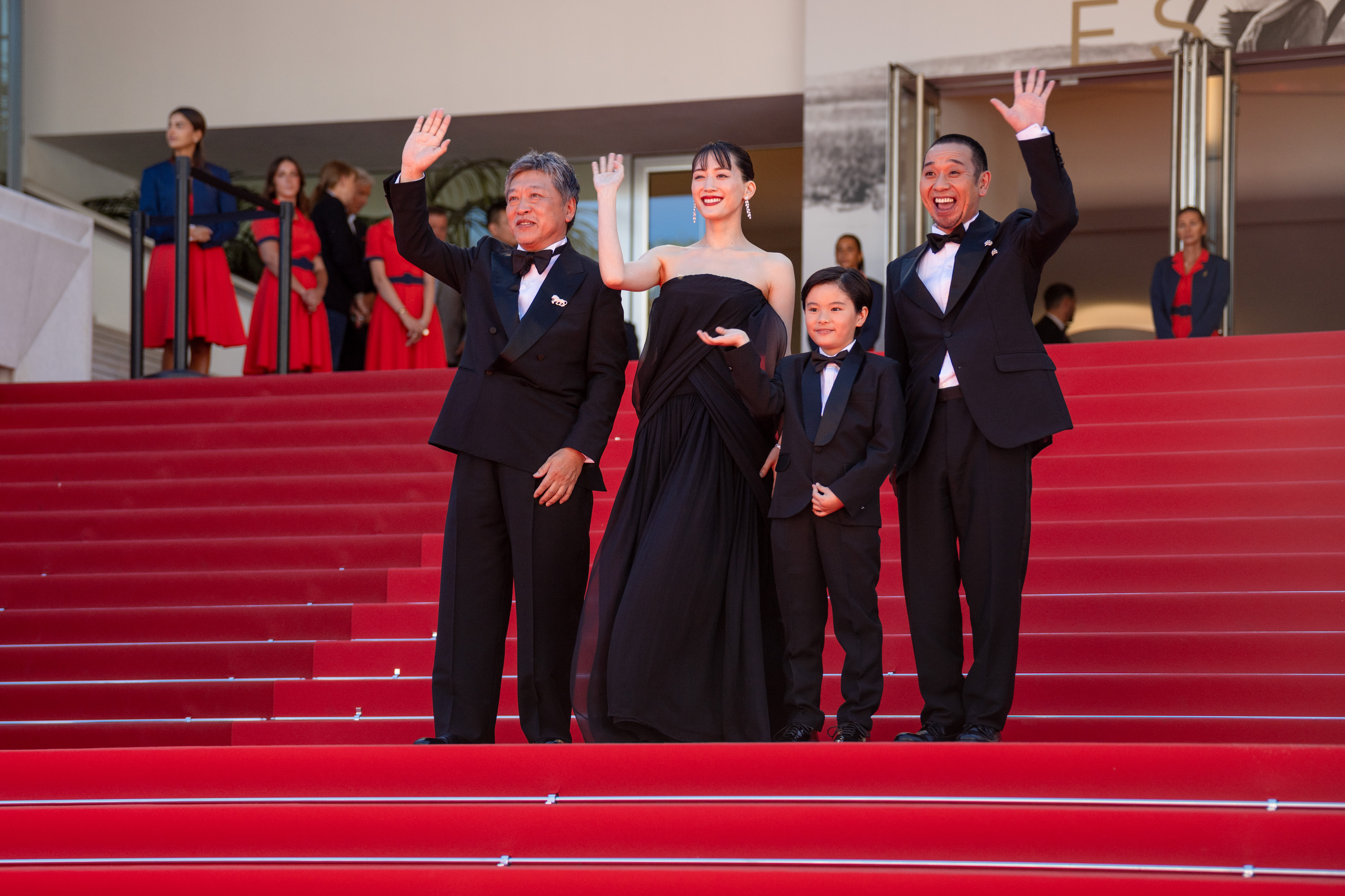 Image Description: Hirokazu Kore-eda Haruka Ayase a guest and Daigo attend the competition screening red carpet of the movie Sheep in the Box during the 79th Cannes Film Festival Cannes France 2026-05-16