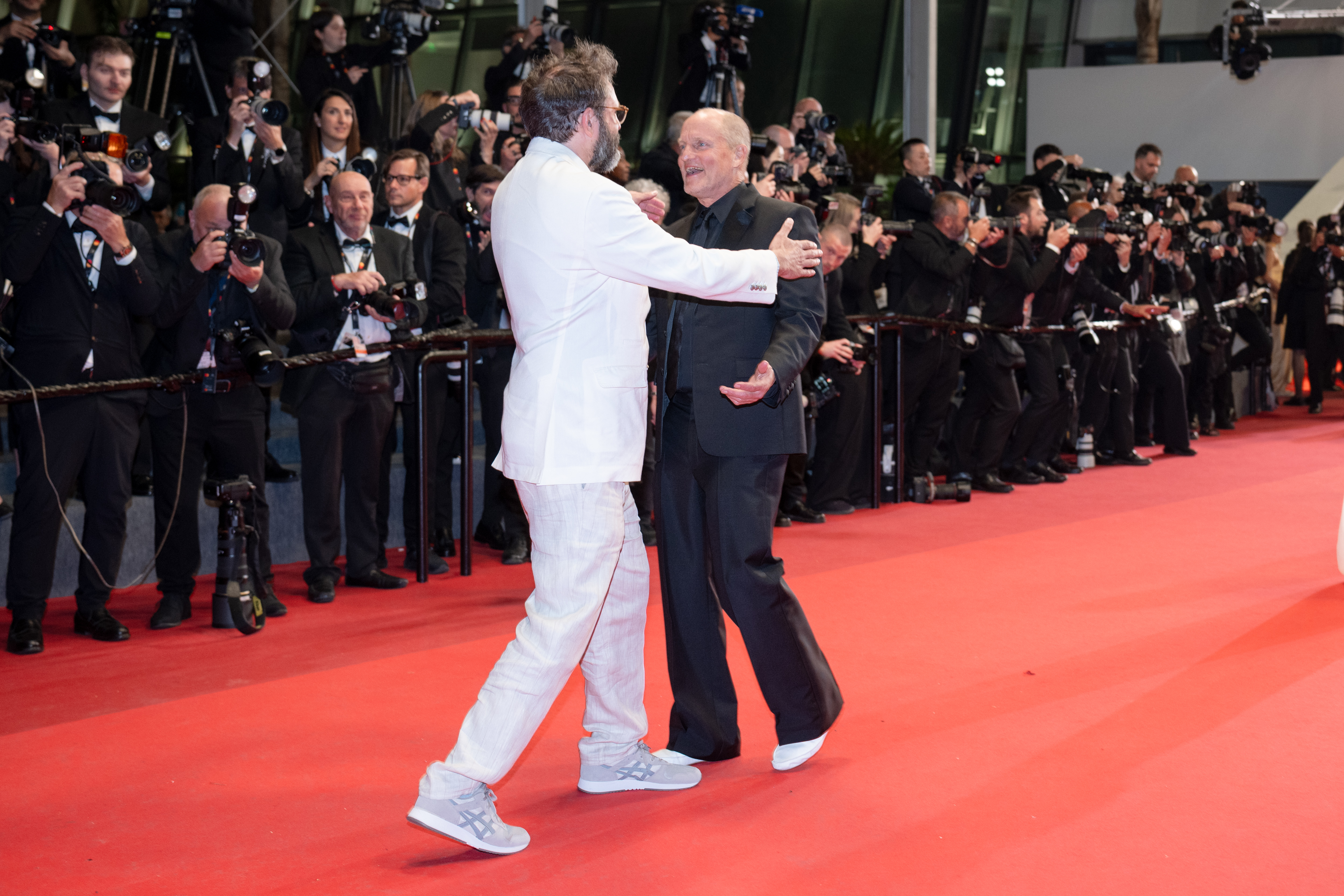 Image Description: Quentin Dupieux and Woody Harrelson attend the midnight screening of the movie Full Phil during the 79th Cannes Film Festival Cannes France 2026-05-16