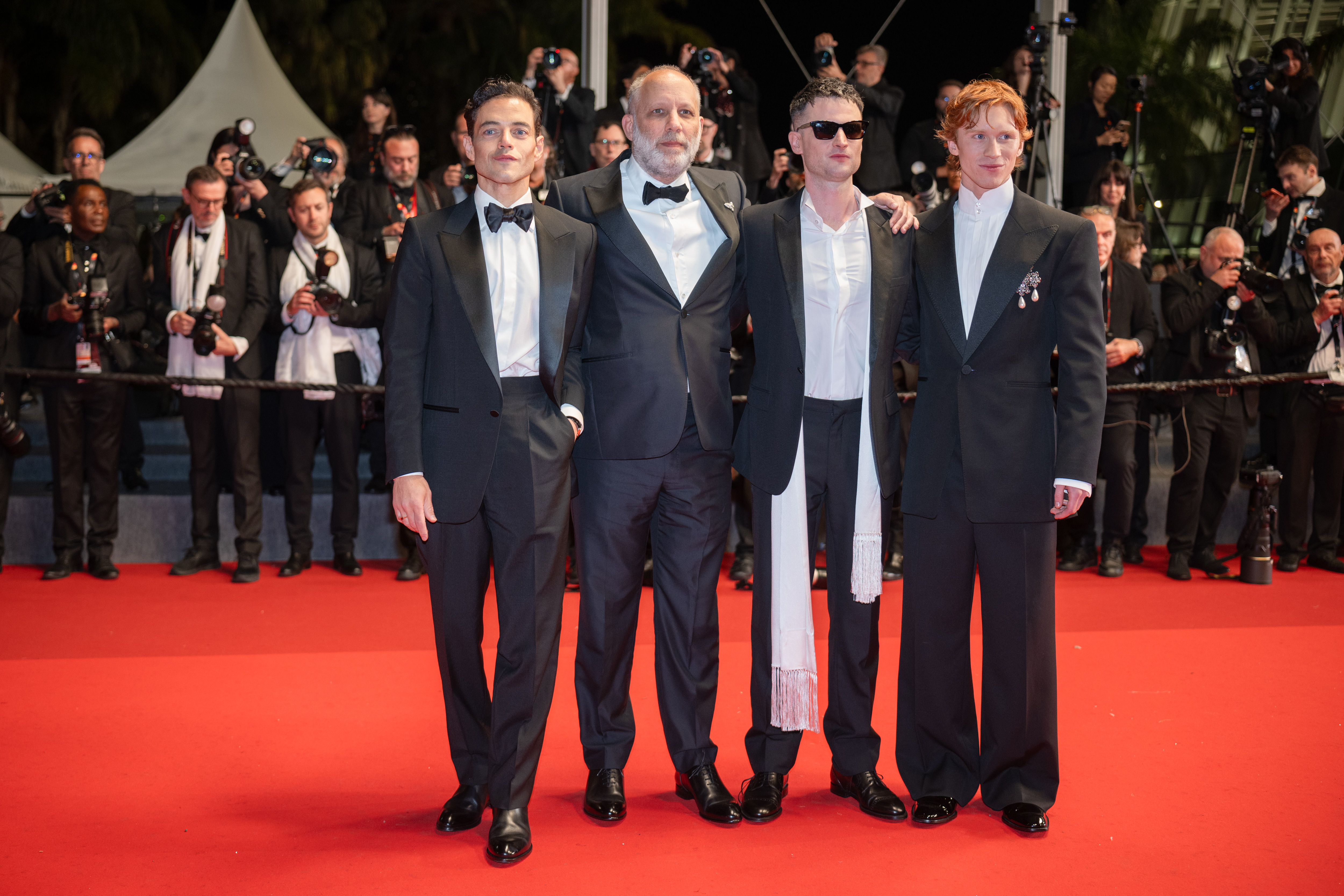 Image Description: Rami Malek Ira Sachs Tom Sturridge and Luther Ford attend the competition screening red carpet of the movie The Man I Love during the 79th Cannes Film Festival Cannes France 2026-05-20