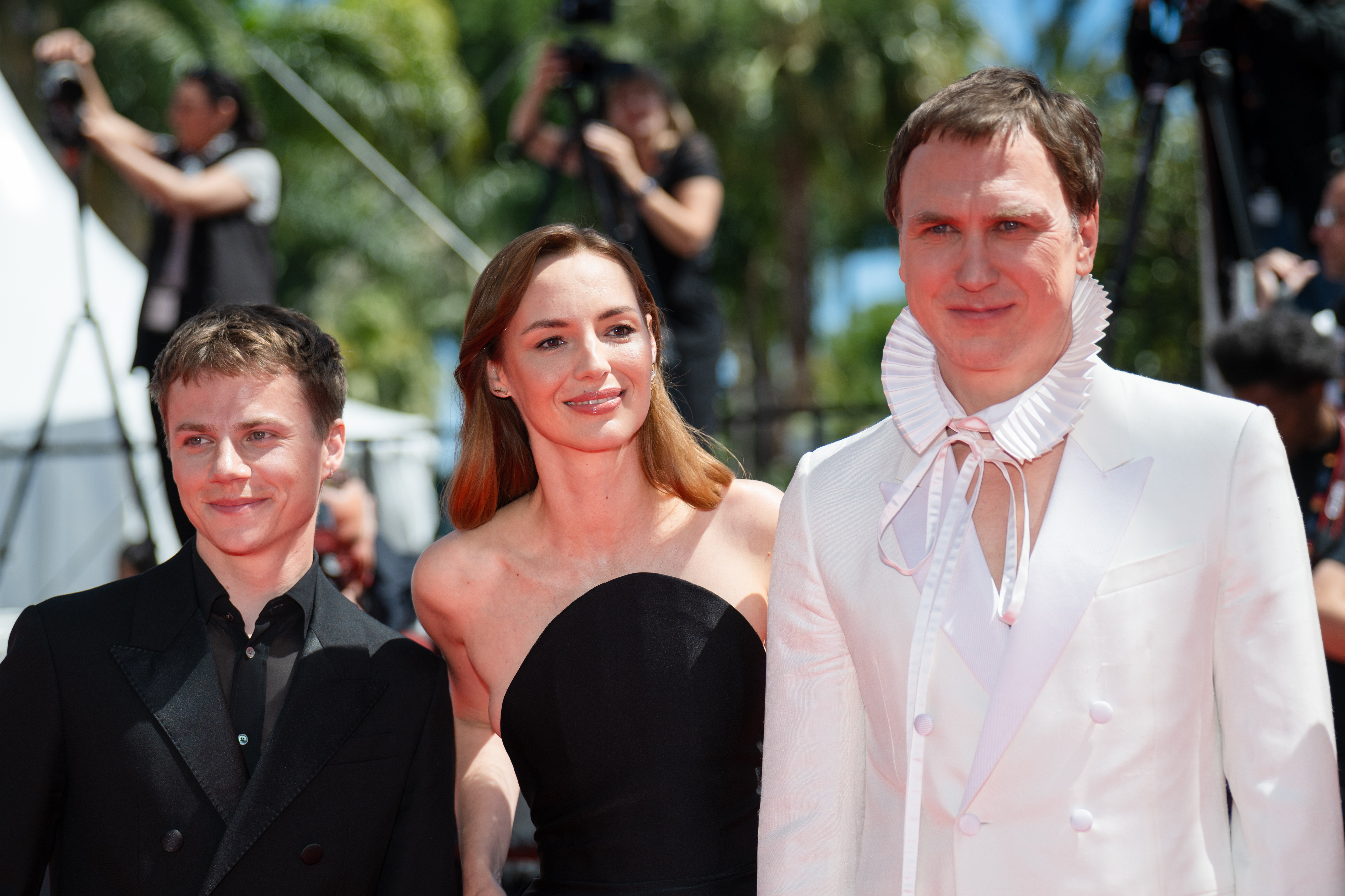 Image Description: Felix Lefebvre Louise Bourgoin and Lars Eidinger attend the competition screening red carpet of the movie Moulin during the 79th Cannes Film Festival Cannes France 2026-05-17