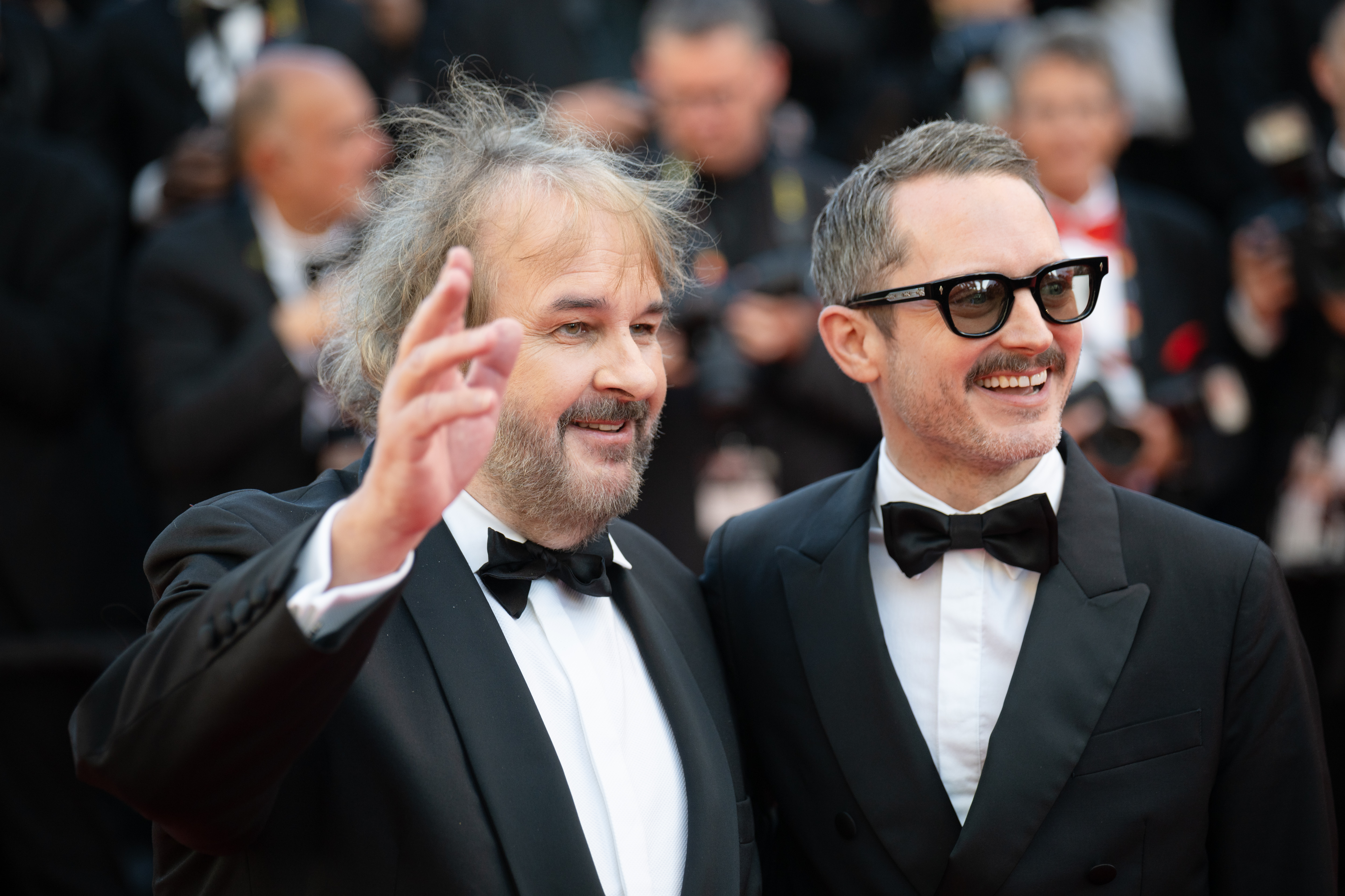 Image Description: Peter Jackson and Elijah Wood attend the opening ceremony red carpet of the movie La Venus Electrique during the 79th Cannes Film Festival Cannes France 2026-05-12