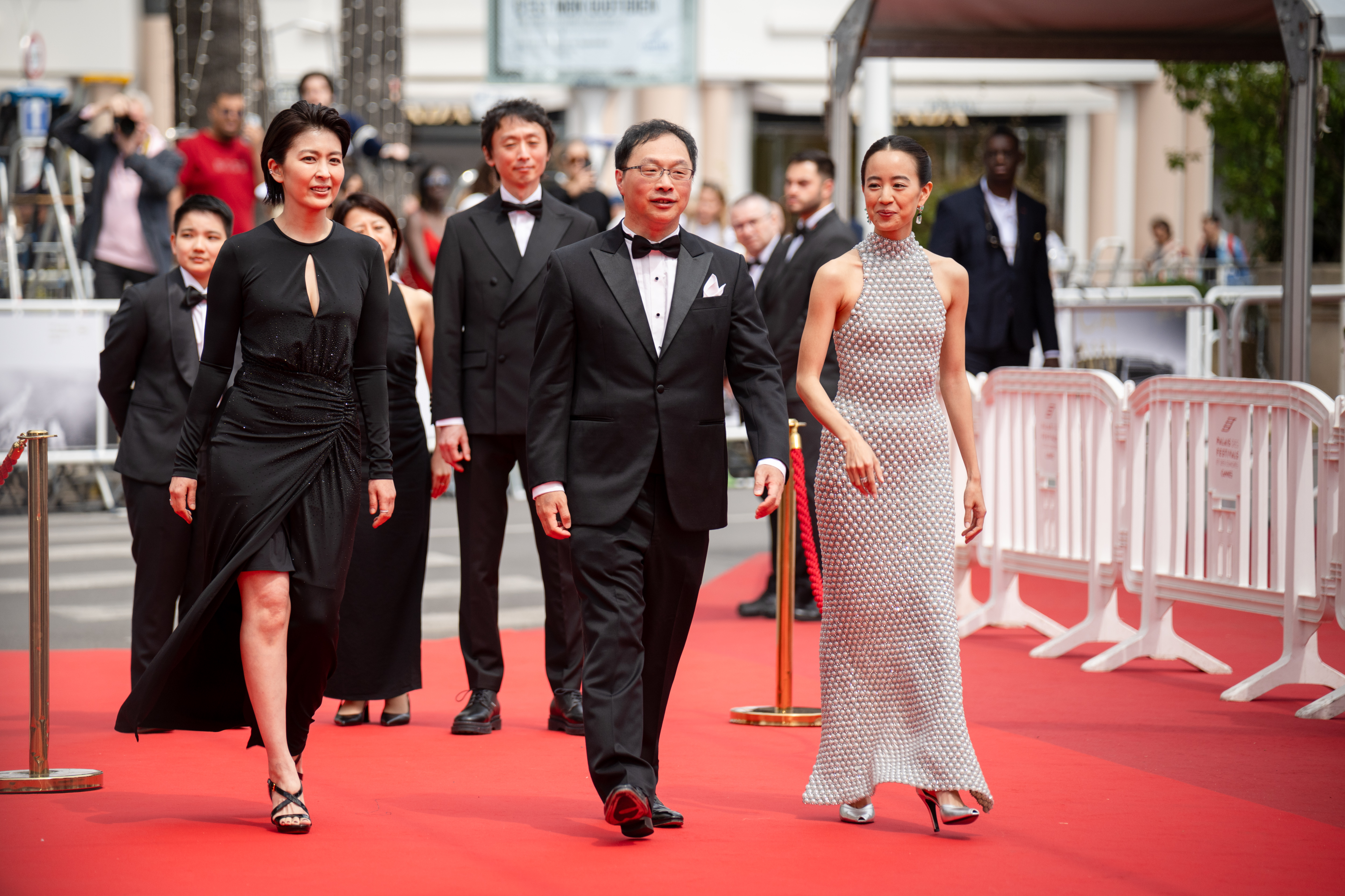 Image Description: Takako Matsu Koji Fukada and Shizuka Ishibaschi attend the competition screening red carpet of the movie Nagi Notes during the 79th Cannes Film Festival Cannes France 2026-05-13