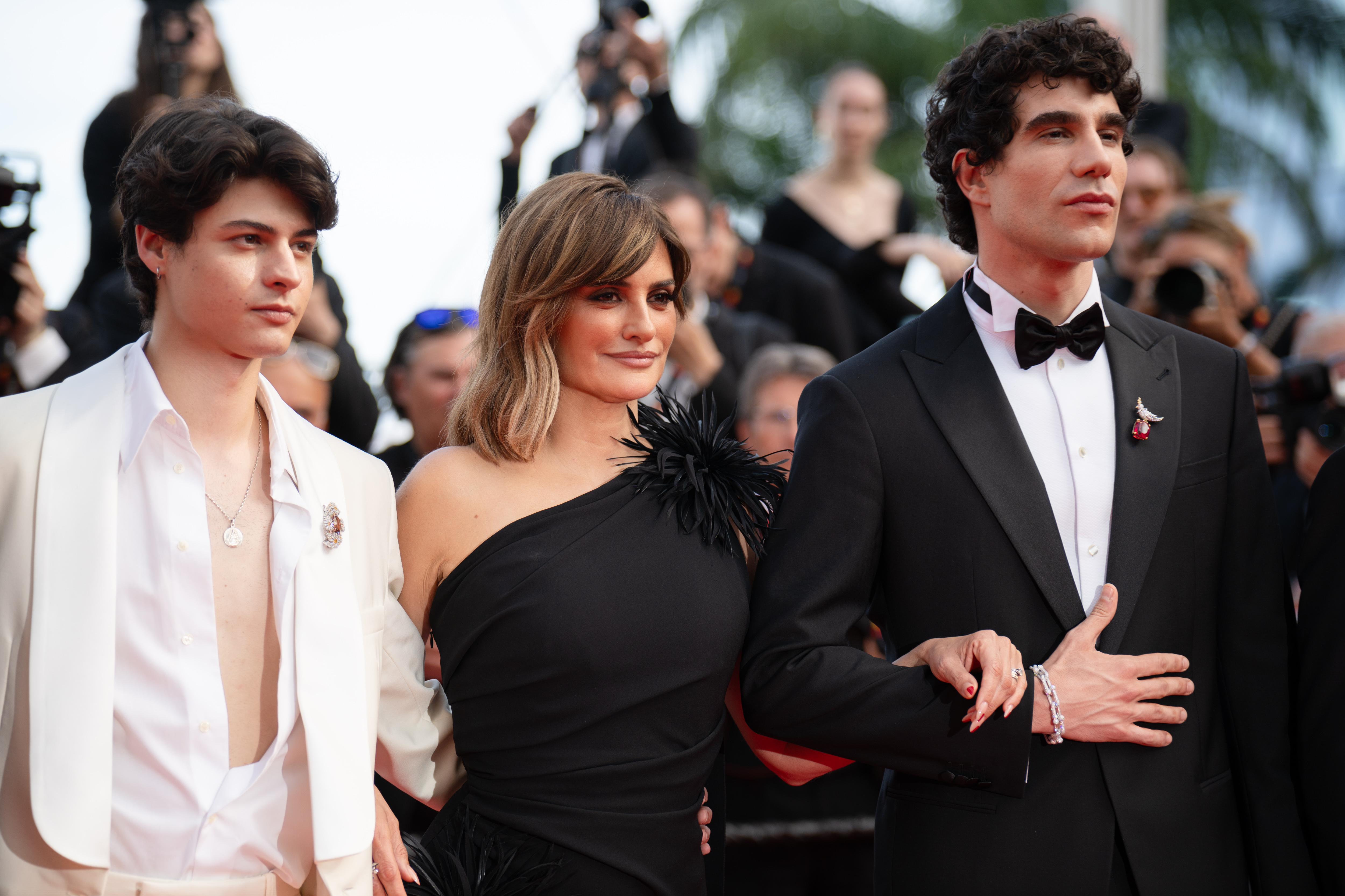 Image Description: Milo Quifes Penelope Cruz and Javier Calvo attend the competition screening red carpet of the movie La Bola Negra during the 79th Cannes Film Festival Cannes France 2026-05-21