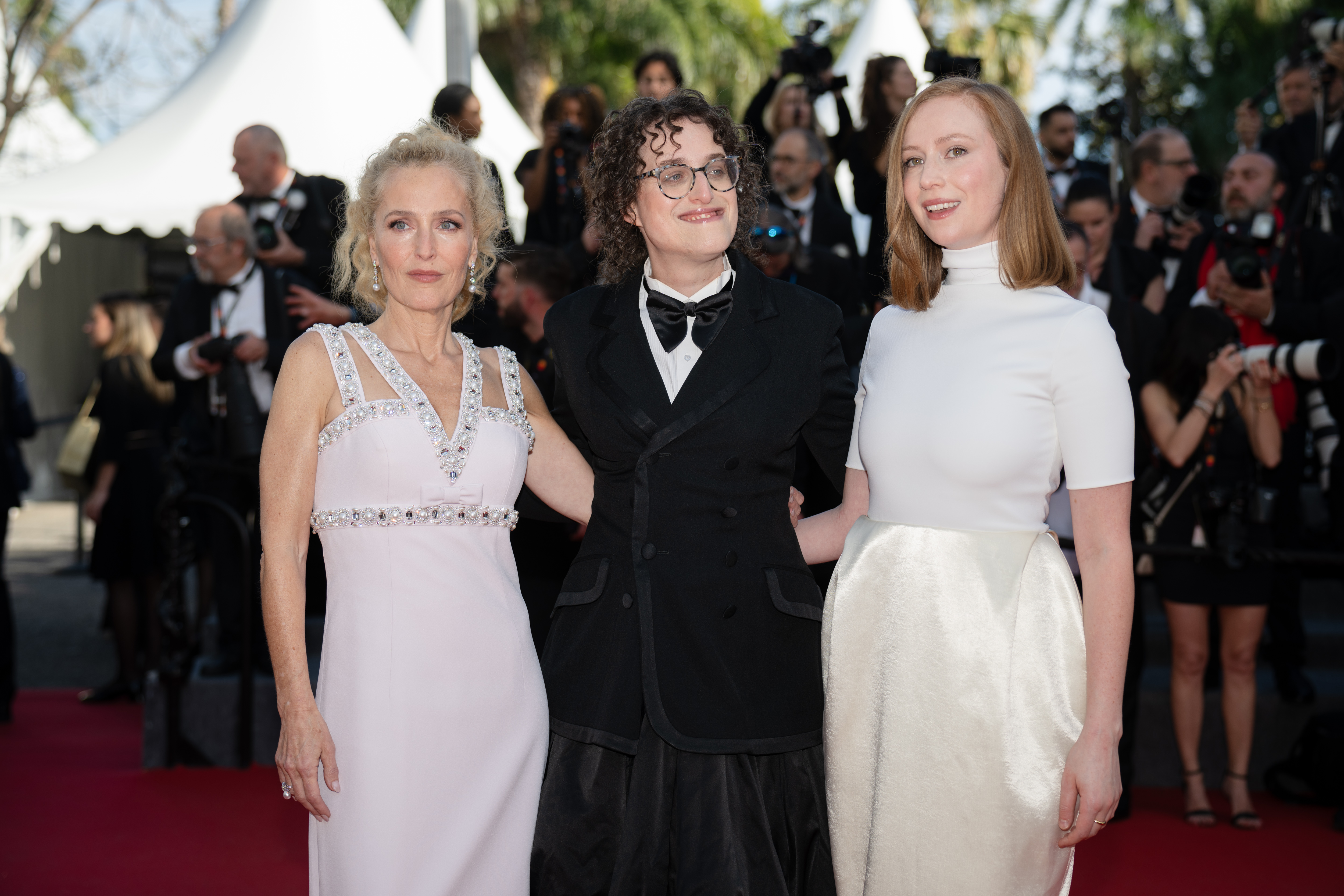 Image Description: Gillian Anderson Jane Schoenbrun and Hannah Einbinder attend the competition screening red carpet of the movie La Vie d'une Femme during the 79th Cannes Film Festival Cannes France 2026-05-13