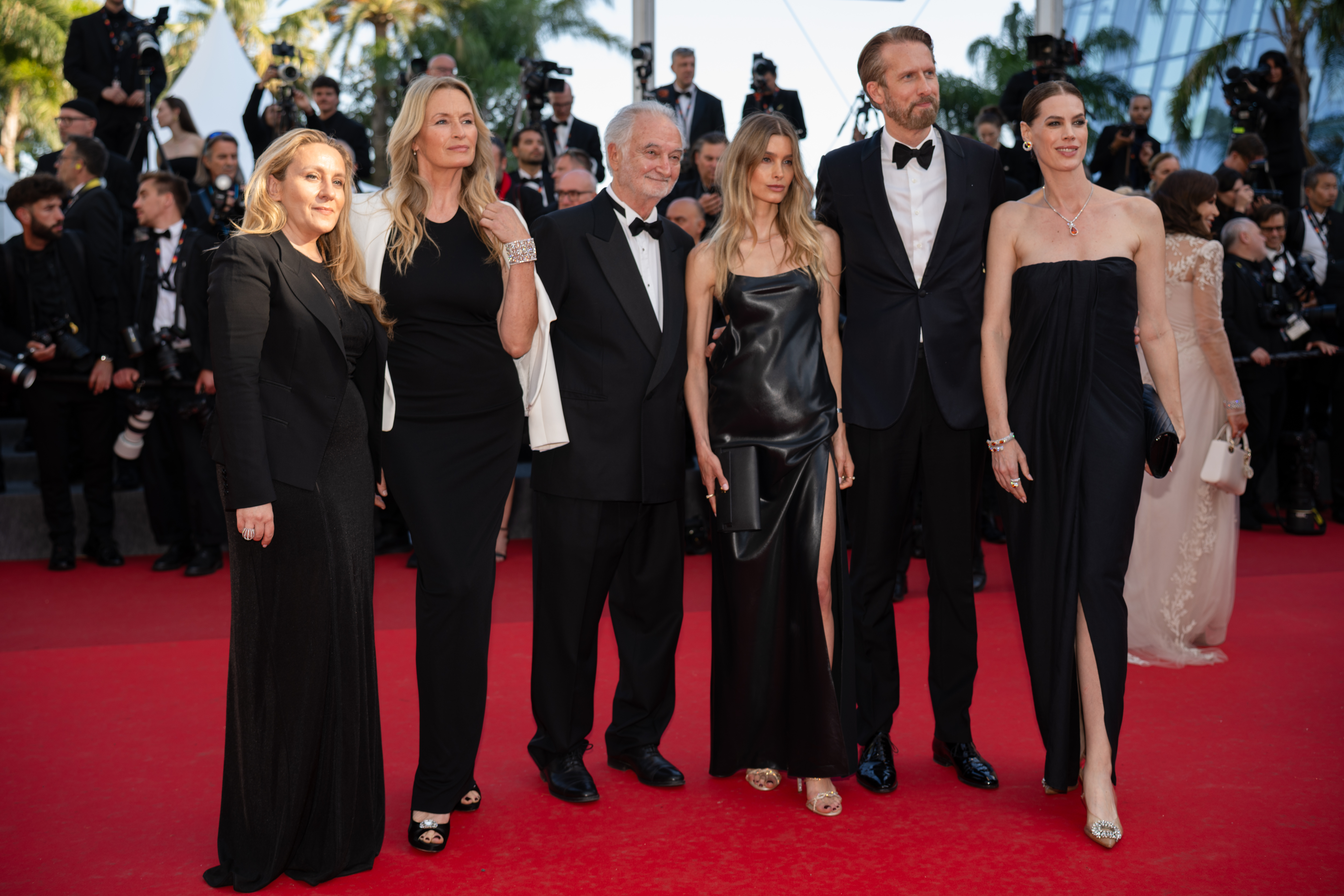 Image Description: Rosalie Miller Mann Estelle Lefebure Jacques Attali a guest Sam Bobino and Candice Duthe attend the competition screening red carpet of the movie Histoires de la Nuit during the 79th Cannes Film Festival Cannes France 2026-05-22