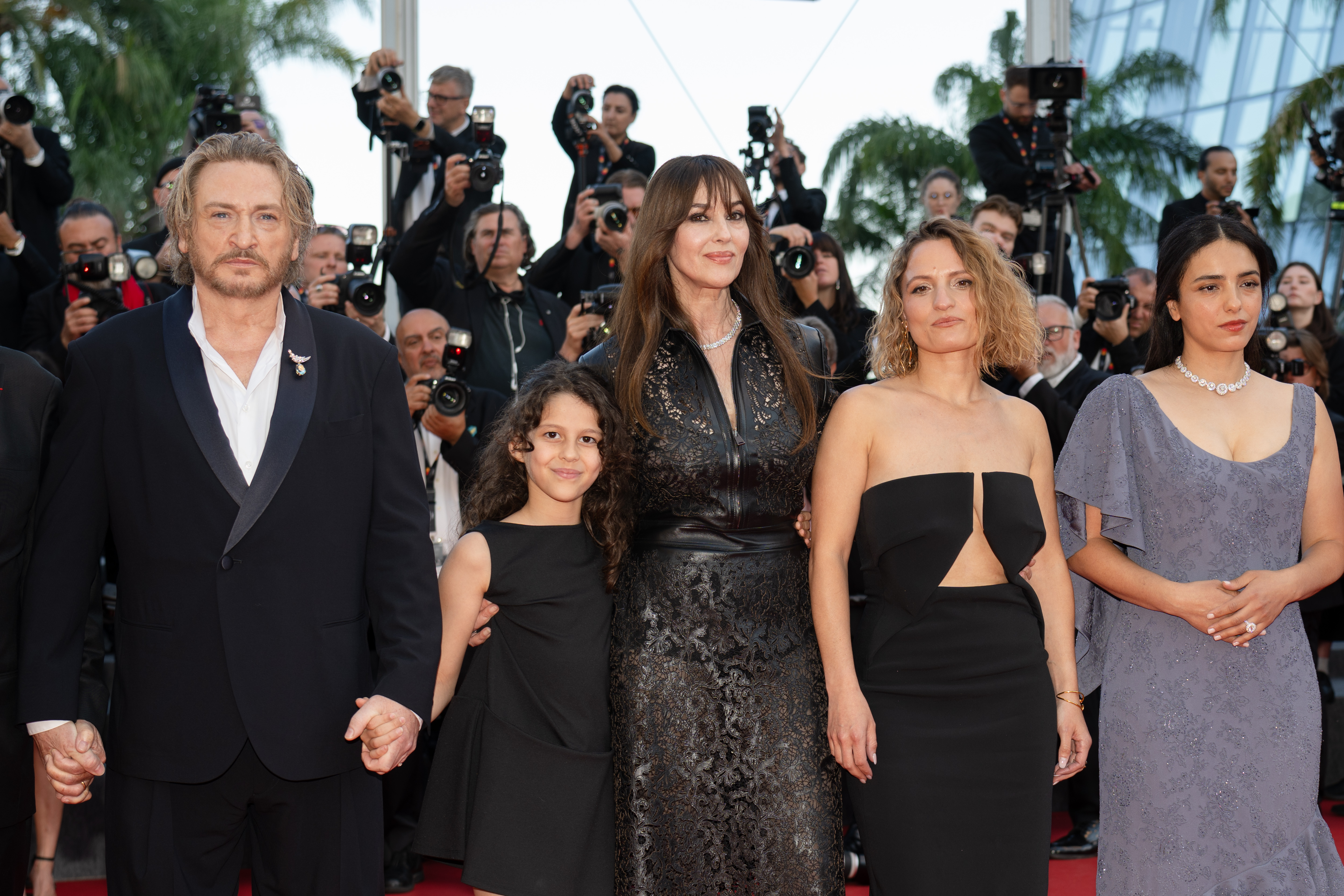 Image Description: Benoit Magimel awba El Gharchi Monica Bellucci Lea Mysius and Hafsia Herzi attend the competition screening red carpet of the movie Histoires de la Nuit during the 79th Cannes Film Festival Cannes France 2026-05-22