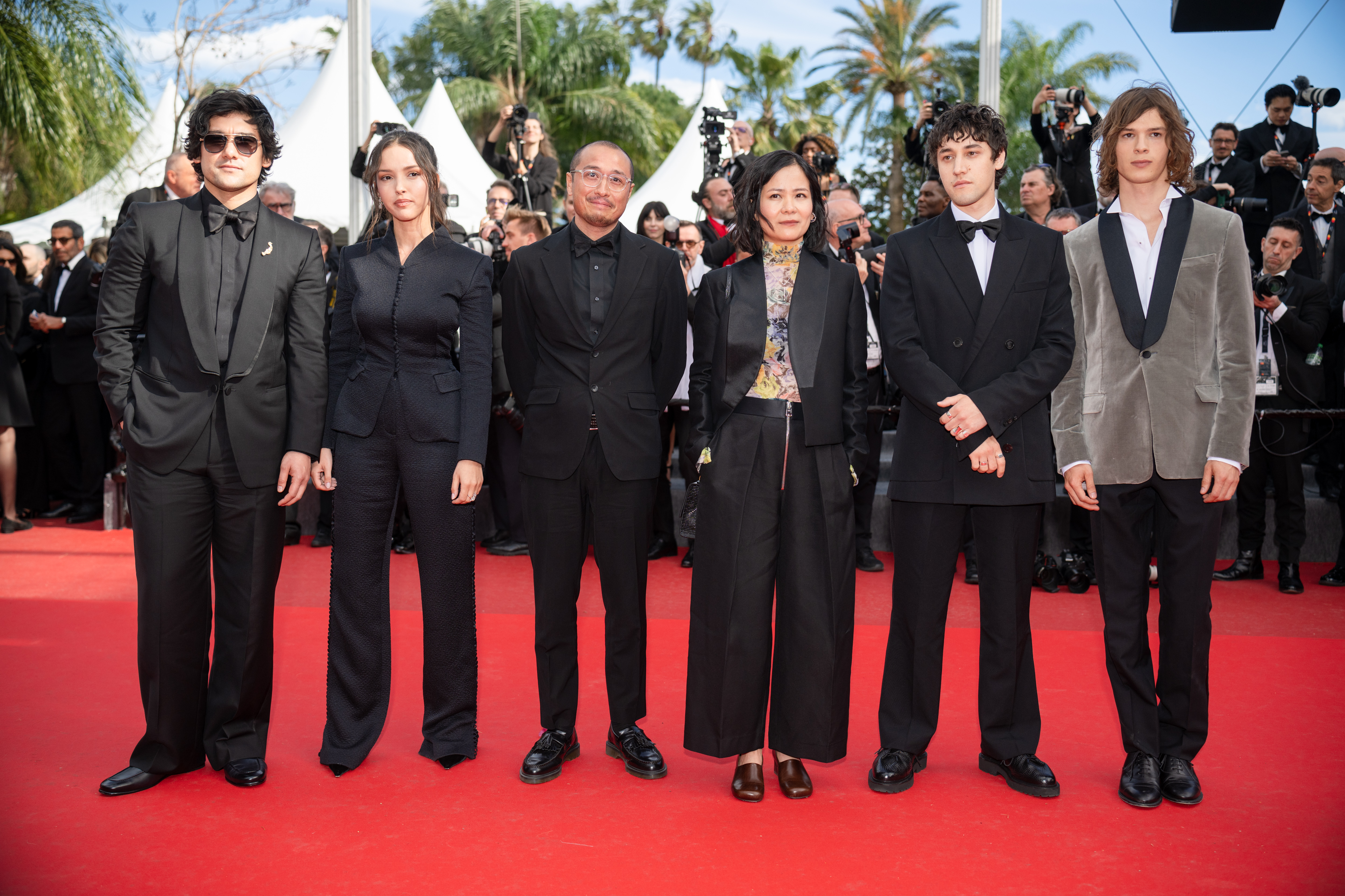 Image Description: Will Sharpe Lyna Khoudri AJ Dungo Phuong Mai Nguyen Paul Kircher and Rio Vega attend the competition screening red carpet of the movie Fatherland during the 79th Cannes Film Festival Cannes France 2026-05-14